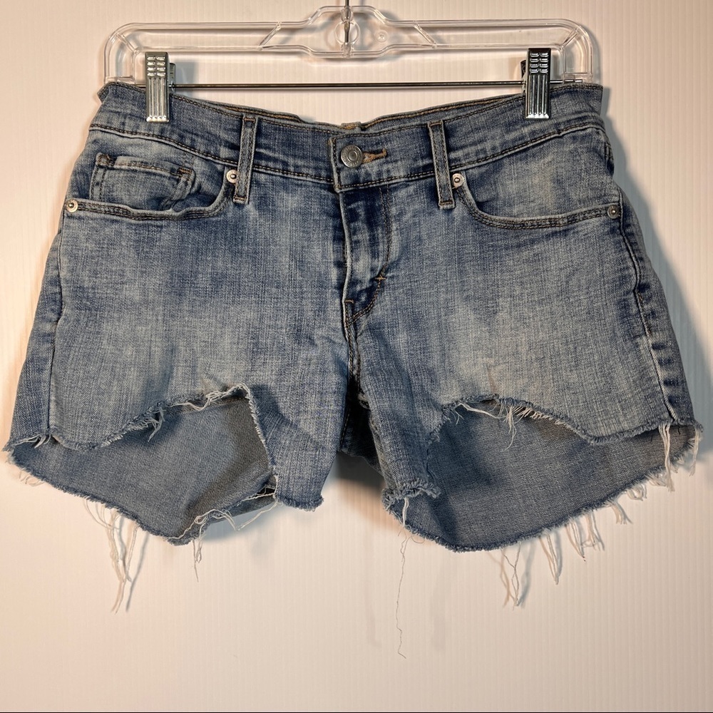 LEVI’S 524 SKINNY CUTOFFS. 4 Pockets with ragged hem. 14” Waist. 7-½” Rise.